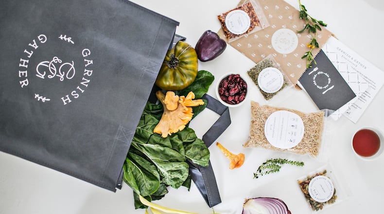 A Garnish & Gather meal kit comes in a reusable grocery bag with prepared and portion ingredients, a recipe card and a "table topic" card. (Photo credit: Heidi Geldhauser)