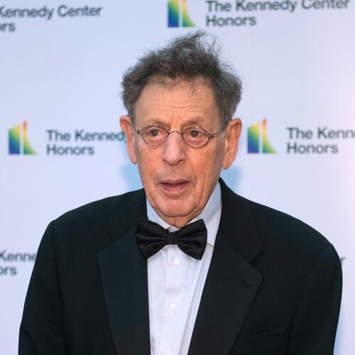 FILE - 2018 Kennedy Center Honoree composer Philip Glass arrives at the State Department for the Kennedy Center Honors State Department Dinner, Dec. 1, 2018, in Washington. (AP Photo/Kevin Wolf, File)