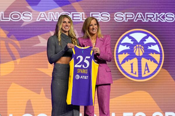 Alabama's Sarah Ashlee Barker, left, poses for a photo with WNBA commissioner Cathy Engelbert after being selected ninth overall by the Los Angeles Sparks during the first round of the WNBA basketball draft, Monday, April 14, 2025, in New York. (AP Photo/Pamela Smith)