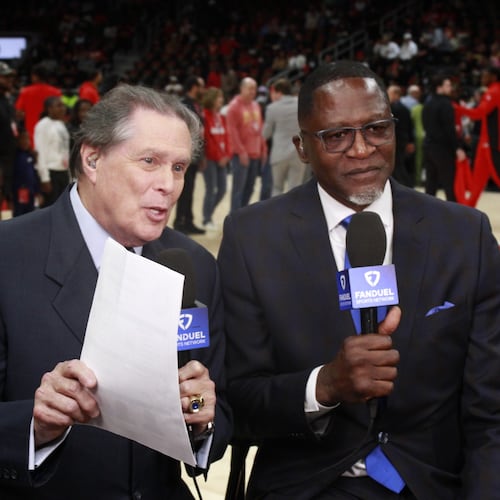 Bob Rathbun (left), joined here by Hawks icon Dominique Wilkins, has been a fixture as the Hawks' TV play-by-play announcer for 30 years. (Courtesy of FanDuel Sports Network)