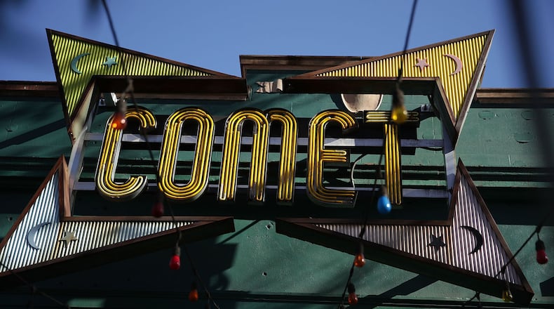 The sign of Comet Ping Pong pizzeria is seen on Connecticut Avenue December 5, 2016 in Washington, DC. A man was arrested Sunday after walking into the pizzeria and discharging a rifle, claiming he was 'self-investigating' an online conspiracy theory about a pedophilia ring being run by high-ranking Democrats, including Hillary Clinton.