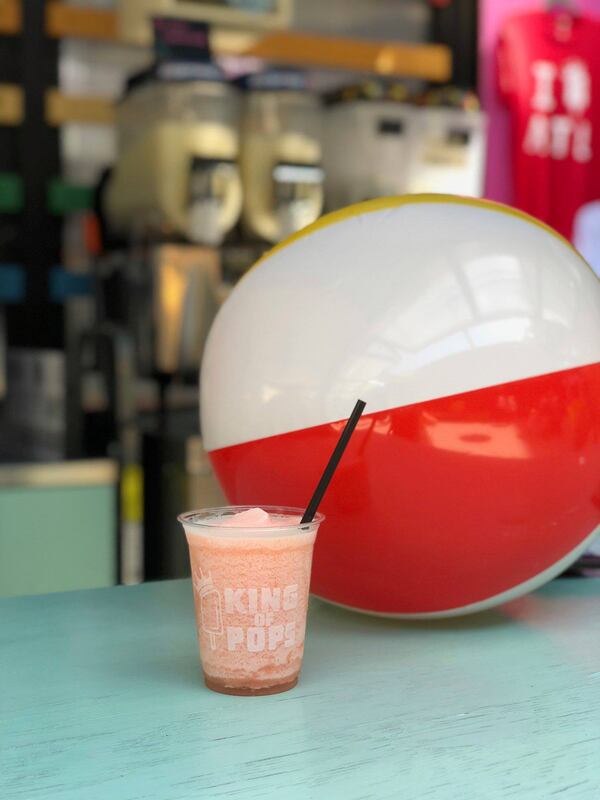 Lifeguards serving boozy slushies get you into beach mode at King of Pos O4W Beach Bar