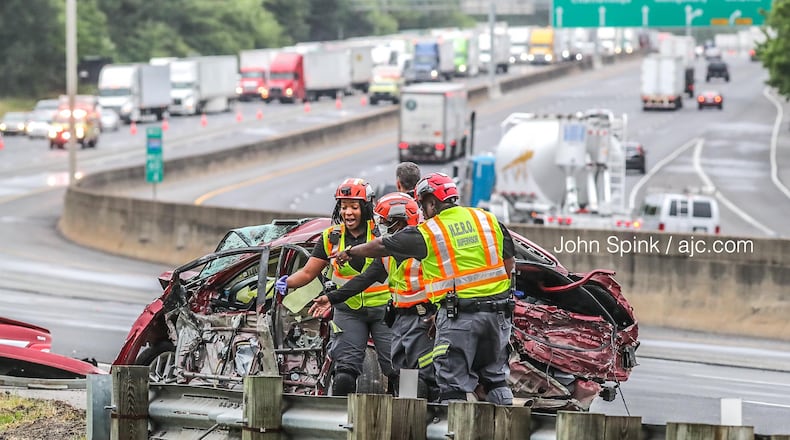 A mangled vehicle was on the scene of a crash investigation that shut down I-285 East for hours Wednesday morning in College Park.