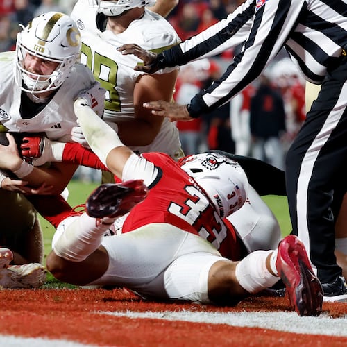 Georgia Tech quarterback Haynes King (center) is prevented from reaching the end zone by North Carolina State linebacker Kenny Soares Jr. (right, on ground) during the second half Saturday, Nov. 1, 2025, in Raleigh, N.C. (Karl DeBlaker/AP)