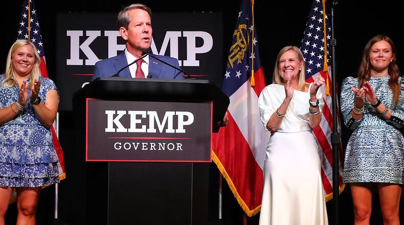 Governor Brian Kemp delivers his election night party speech backed by his wife and children (from left) Lucy, Jarrett, First Lady Marty Kemp, and Amy at the College Football Hall of Fame on Tuesday, May 24, 2022, in Atlanta. Curtis Compton / Curtis.Compton@ajc.com