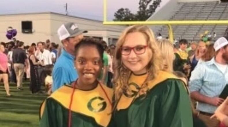 Kennedy Sanders, left, and Emily Middleton at their graduation from Ware County High School in Georgia in 2017.