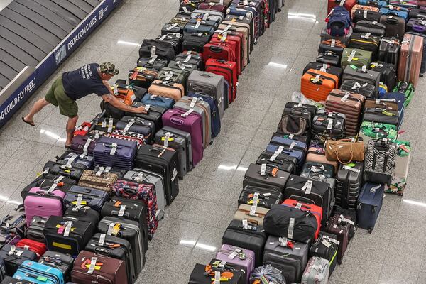 Rows of baggage on the floors in the baggage claim area of the domestic terminal at Hartsfield-Jackson International Airport on Tuesday, July 23, 2024, on the fifth day of a massive global technology outage that has severely impacted the operations of Delta Air Lines. John Spink/AJC