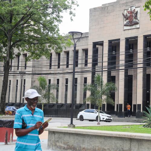 FILE - The country's coat of arms is displayed on the facade of a government building in Port-of-Spain, Trinidad and Tobago, Aug. 20, 2024. (AP Photo/Ash Allen, File)