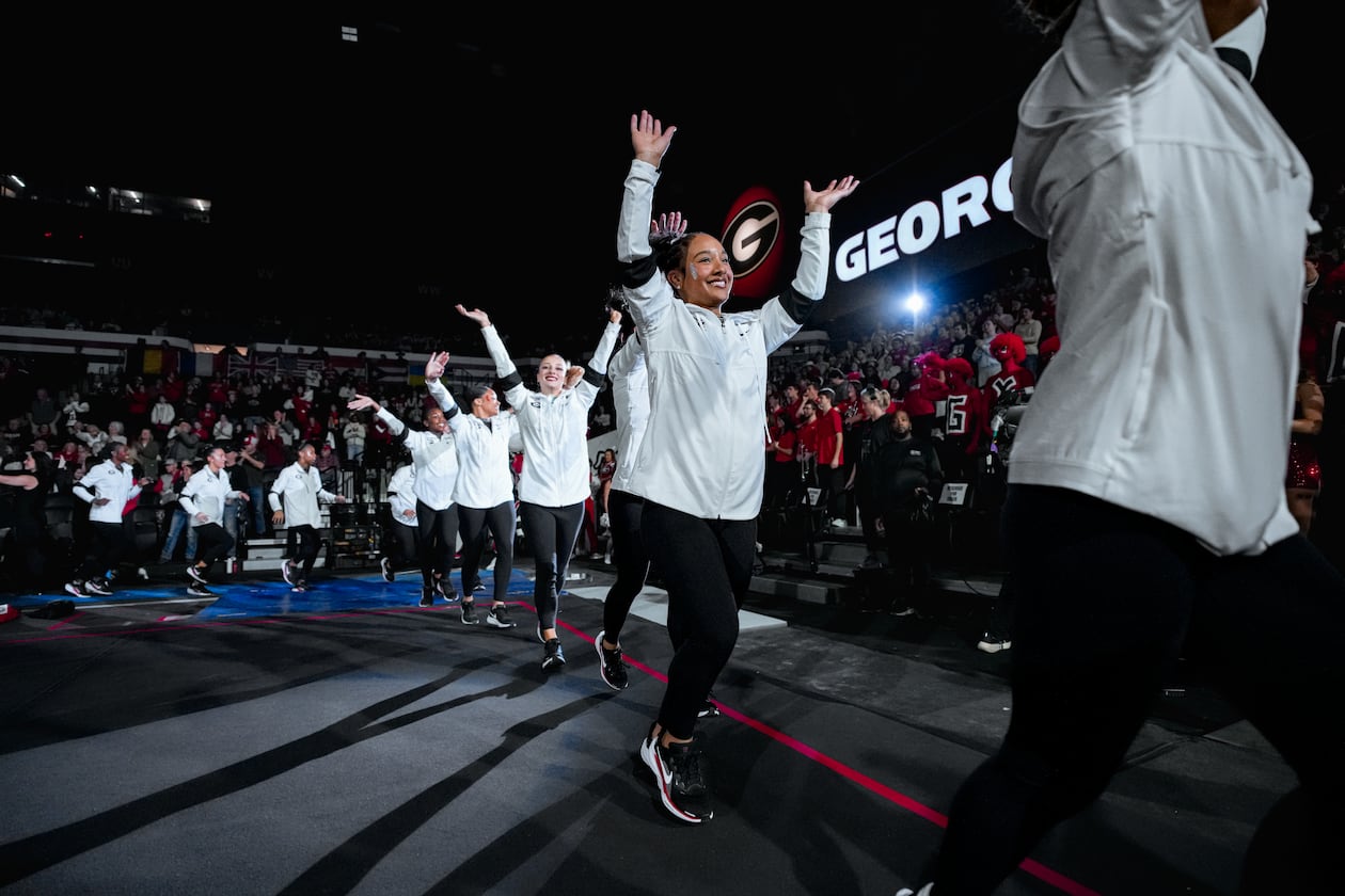 Georgia freshman gymnast CaMarah Williams (center) — pictured before the Bulldogs' meet against Auburn in February — is the team's leader in performances of 9.900 or higher this season with 19. (Tony Walsh/UGAAA)