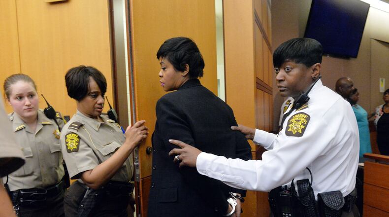 APRIL 1, 2015 ATLANTA Deputies lead former APS Deerwood Academy asst principal Tabeeka Jordan to a holding cell following her conviction on Violation of Racketeer Influenced and Corrupt Organizations Act charges Wednesday. A jury of six men and six women convicted 11 of 12 defendants on RICO and other assorted charges on their eighth day of deliberations in the Atlanta Public Schools test-cheating trial on Wednesday, April 1, 2015. Jurors sorted through roughly five months of testimony against 12 former educators accused of engaging in a racketeering conspiracy to inflate test scores. (Atlanta Journal-Constitution, Kent D. Johnson, Pool)