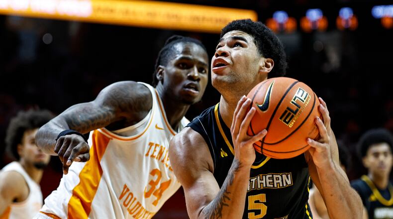 FILE - Northern Kentucky forward LJ Wells (5) goes for a shot as he's defended by Tennessee center Felix Okpara (34) during the second half of an NCAA college basketball game Nov. 8, 2025, in Knoxville, Tenn. (AP Photo/Wade Payne, File)