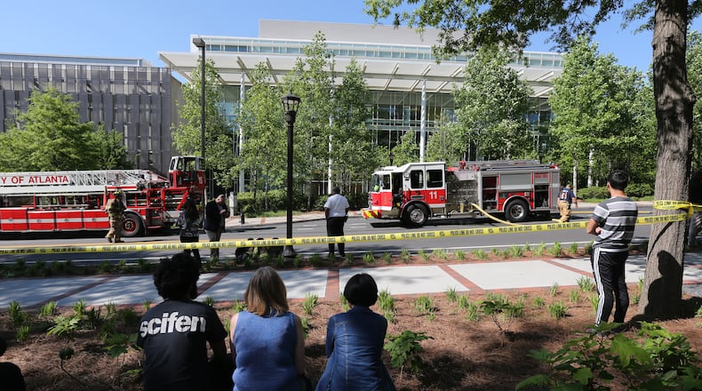 Firefighters responded to a building on the Georgia Tech campus Tuesday after a small explosion in a lab. The building was evacuated. (BEN GRAY / BGRAY@AJC.COM)