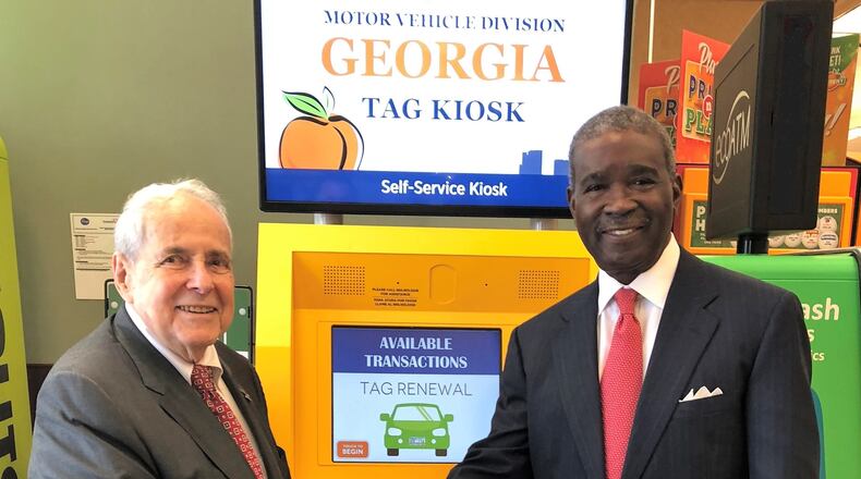 Buckhead Coalition President and former Atlanta Mayor Sam Massell and Fulton County Tax Commissioner Arthur Ferdinand welcome the car tag renewal kiosk in Buckhead. CONTRIBUTED