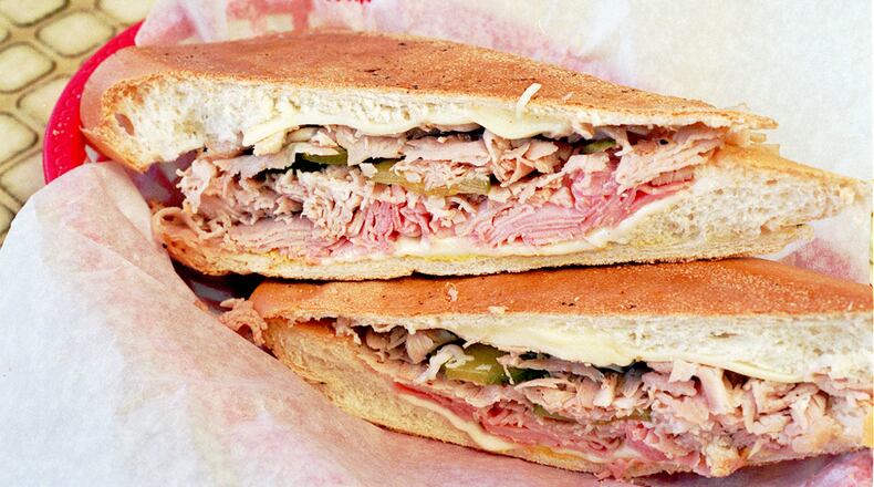 Try a warm cuban from Havana Restaurant on Buford Highway. / AJC file photo