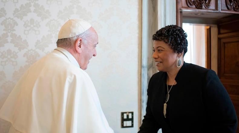 FILE - In this March 12, 2018 file photo, youngest child of civil rights leaders Martin Luther King Jr. Bernice King is welcomed by Pope Francis on the occasion of their private audience at the Vatican. Francis sent a message of prayer Monday to King’s daughter, the Rev. Bernice King, with whom the pontiff met in 2018. He called for unity, not division and extinguishing hatred and “not holding onto it.” (L'Osservatore Romano/Pool Photo via AP)