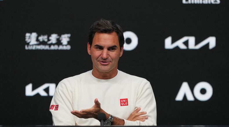 Roger Federer of Switzerland gestures during a press conference ahead of the Australian Open tennis championship in Melbourne, Australia, Thursday, Jan. 15, 2026. (AP Photo/Mark Baker)