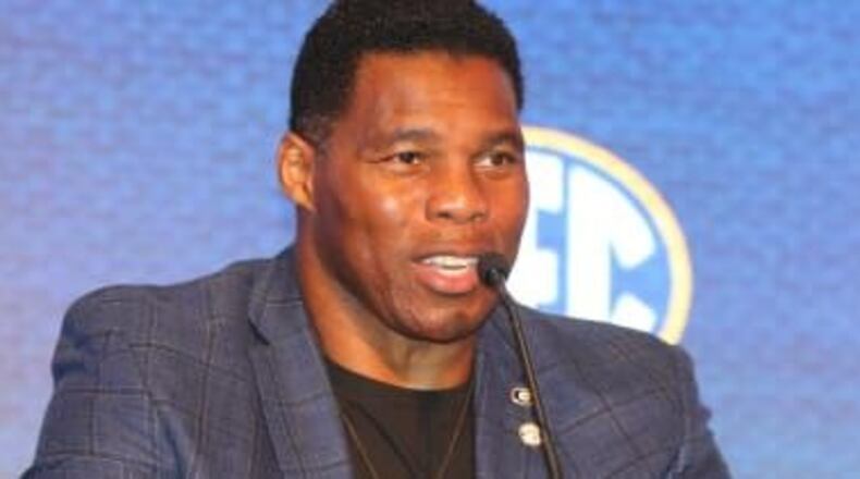 Herschel Walker’s campaign condemns bigotry, protesters want his thoughts on vaccine