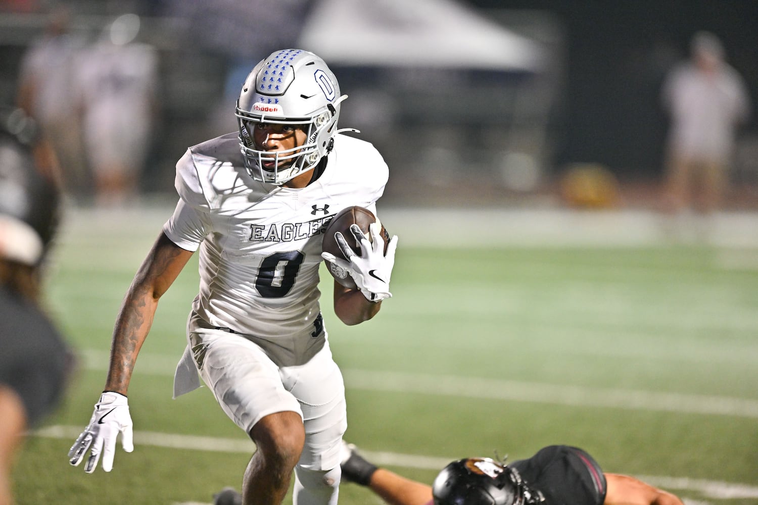 East Jackson wide receiver Branturan Callahan makes a short gain in yardage during the second half of play Friday, Sept. 26, 2025, at Hebron Christian Academy. (Daniel Varnado for the AJC)