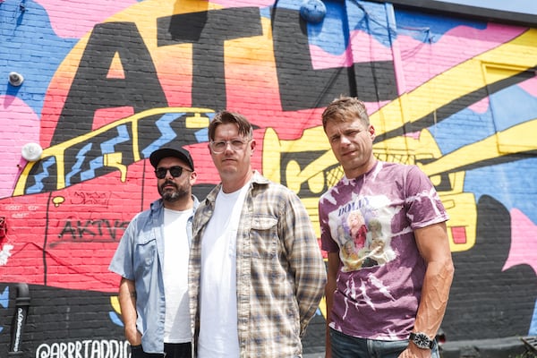The members of punk band Cartel in front of a mural in Little Five Points in Atlanta on Wednesday, August 20, 2025. Cartel is an American pop-punk band formed in Conyers, Georgia, in 2003. (Abbey Cutrer/AJC)