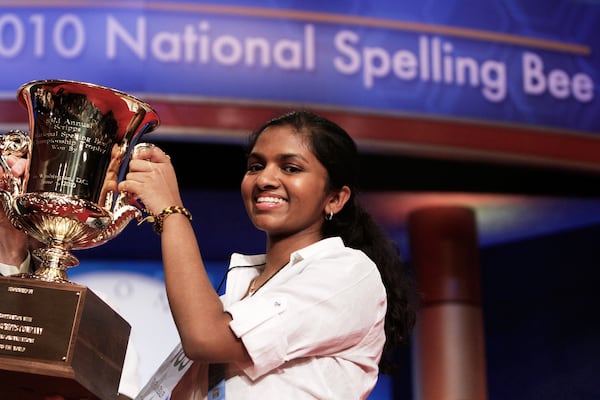 FILE - Anamika Veeramani, 14, of North Royalton, Ohio, holds her trophy after winning the 2010 National Spelling Bee in Washington, June 4, 2010. (AP Photo/Jacquelyn Martin, File)