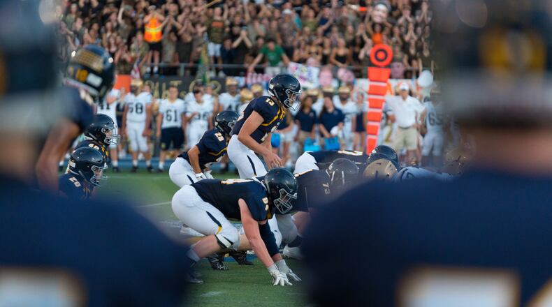 Marist quarterback Connor Cigelske (13) prepares to take a snap.