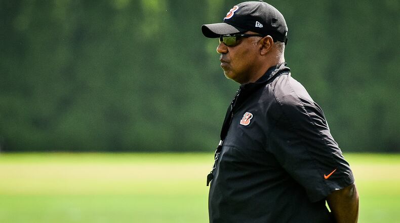 The Cincinnati Bengals’ head coach Marvin Lewis watches the team during organized team activities Tuesday, May 22 at the practice facility near Paul Brown Stadium in Cincinnati. NICK GRAHAM/STAFF