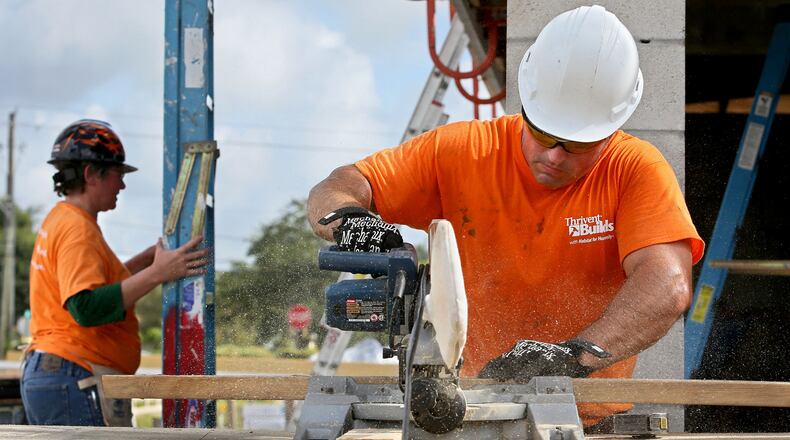 Volunteers work on a Habitat for Humanity home building project in Florida.