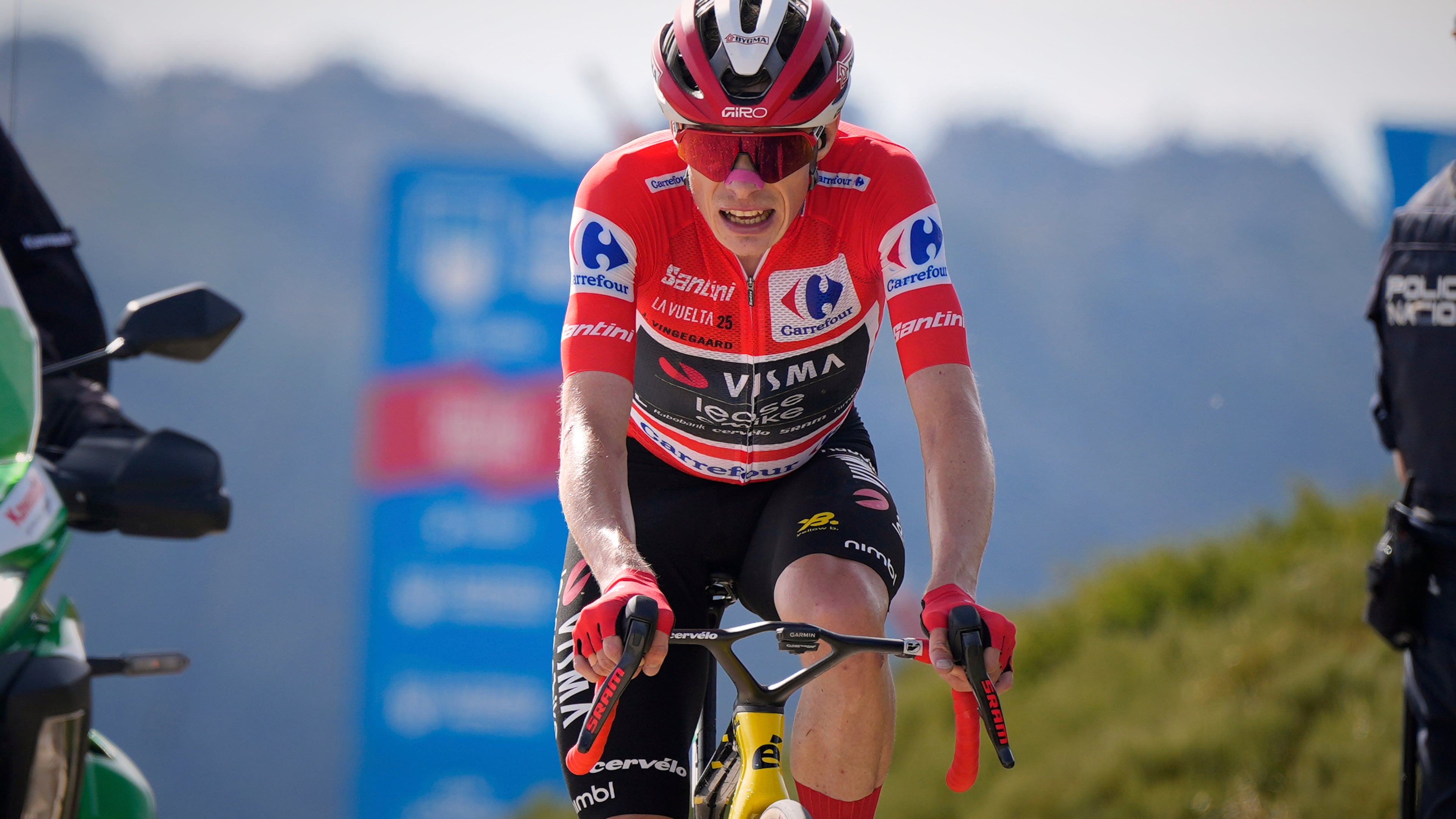 Danish cyclist Jonas Vingegaard completes the final meters before winning the 20th stage and his first overall victory in the Spanish cycling race La Vuelta, from Robledo de Chavela to Bola del Mundo, in Puerto de Navacerrada, Spain, on Saturday, September 13, 2025. (AP Photo/Manu Fernández)