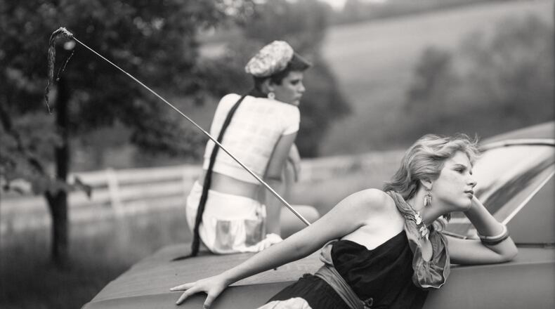 Sally Mann’s photograph “Lisa and Jenny on Car (At Twelve)” is included in the Jackson Fine Art exhibition “At Twelve.” The exhibit revisits photos Mann shot from 1983 to 1985, poignant images of 12-year-old girls on the cusp of womanhood around her home in Virginia. Courtesy of Sally Mann