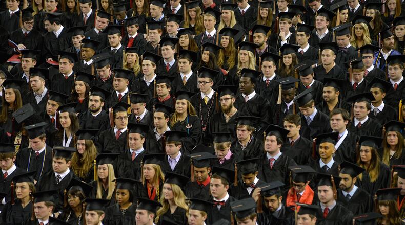 Graduating class members listens to University of Georgia President Jere Morehead speak during the university' fall undergraduate commencement ceremony at Stegeman Coliseum, Friday, Dec. 19, 2014 in Athens, Ga. (AP Photo/The Banner-Herald, Richard Hamm)