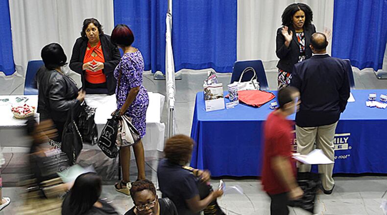 September 18, 2014 - Marietta - More than 80 employers had booths at today's CobbWorks job fair at the Cobb County Civic Center in Marietta. Georgia’s unemployment rate jumped to 8.1 percent in August from a revised 7.7 percent in July — even as the number of jobs increased and layoffs declined, the state labor department said Thursday. BOB ANDRES / BANDRES@AJC.COM