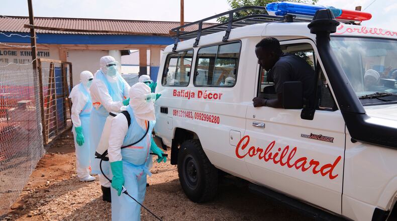 Health workers disinfects an ambulance at Ebola Treatment Center at Bunia General Hospital in Ituri, Congo, Wednesday, July 22, 2026. (AP Photo/Dirole Lotsima Dieudonne)