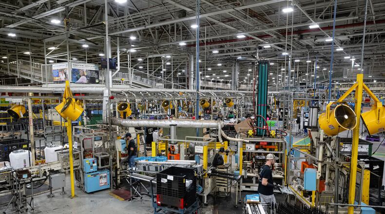 FILE - Employees piece together components on an assembly line at GE Appliances global headquarters, Aug 13, 2025, in Louisville, Ky. (AP Photo/Jon Cherry, file)
