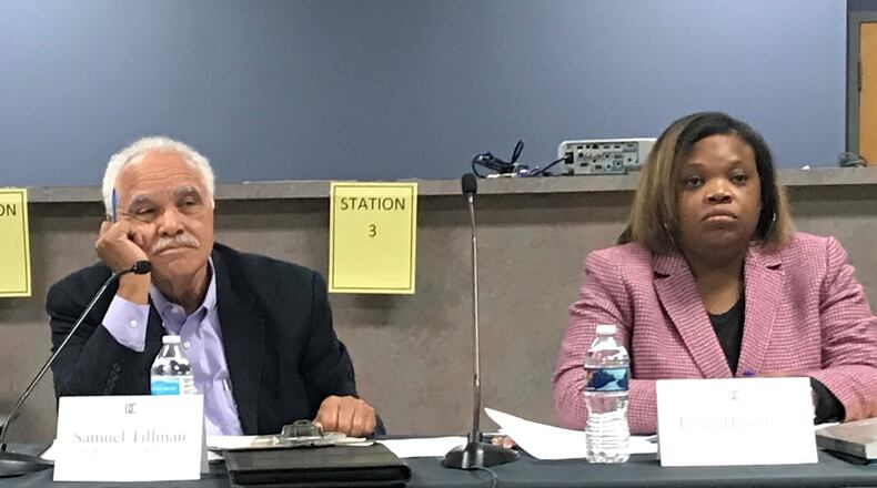 DeKalb County elections board chairman Samuel Tillman, left, and elections director Erica Hamilton during Thursday night's elections board meeting. TYLER ESTEP / TYLER.ESTEP@AJC.COM