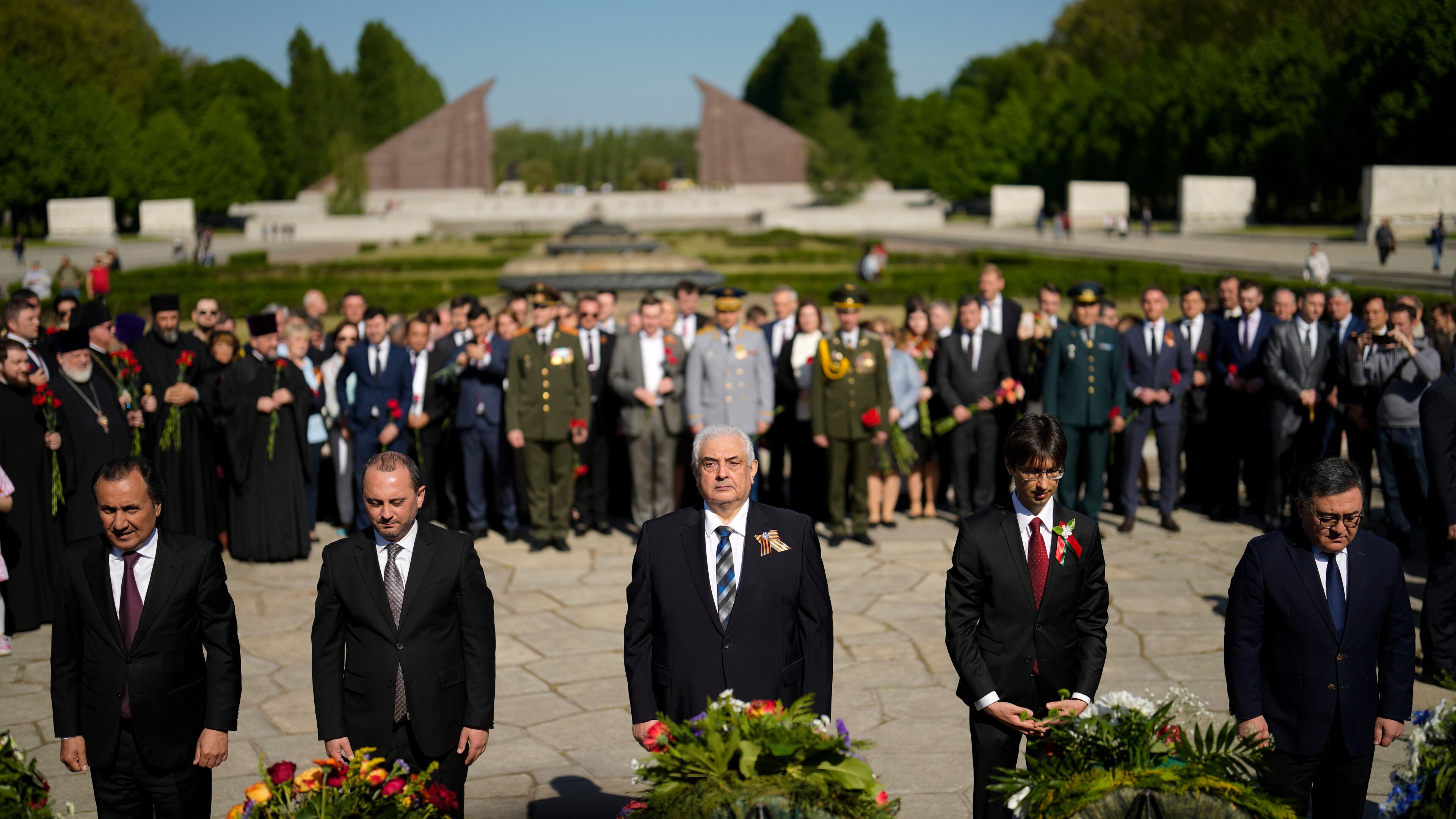 FILE — Russian ambassador in Germany Sergey Nechayev, center, attends a wreath laying ceremony to commemorate the end of World War II 77 years ago at the Soviet War Memorial at the district Treptow in Berlin, Germany, May 9, 2022. (AP Photo/Markus Schreiber, File)