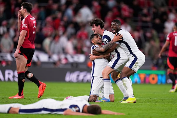 Tottenham players celebrate after winning the Europa League final soccer match between against Manchester United at the San Mames Stadium in Bilbao, Spain, Wednesday, May 21, 2025. (AP Photo/Manu Fernandez)