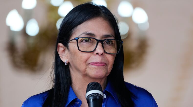 Venezuela's acting President Delcy Rodriguez makes a statement to the press at Miraflores presidential palace in Caracas, Venezuela, Wednesday, Jan. 14, 2026. (AP Photo/Ariana Cubillos)