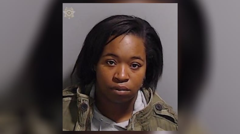 Kayla Elizabeth Wilson was arrested on charges of murder and possession of a weapon during the commission of a felony in a Sunday morning shooting outside a downtown Atlanta strip club.
