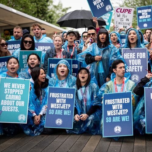 WestJet flight attendants strike at Vancouver International Airport in Richmond, British Columbia, Sunday, Aug. 2, 2026. (Ethan Cairns/The Canadian Press via AP)
