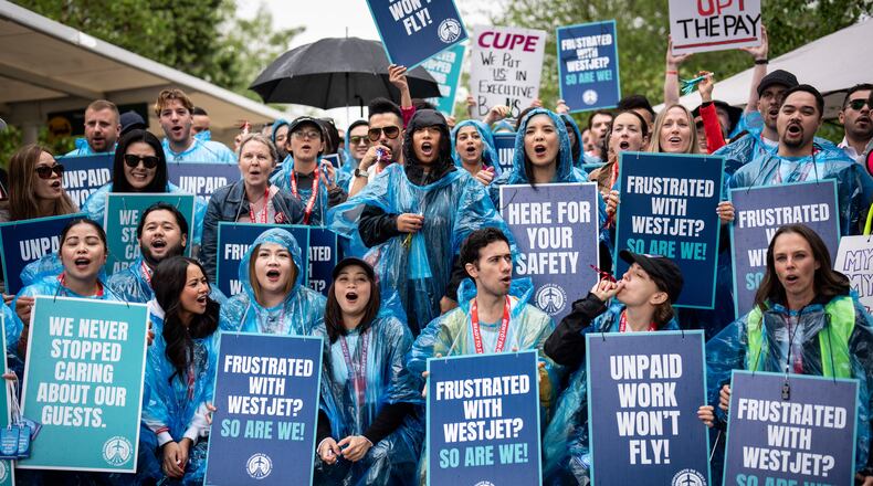 WestJet flight attendants strike at Vancouver International Airport in Richmond, British Columbia, Sunday, Aug. 2, 2026. (Ethan Cairns/The Canadian Press via AP)