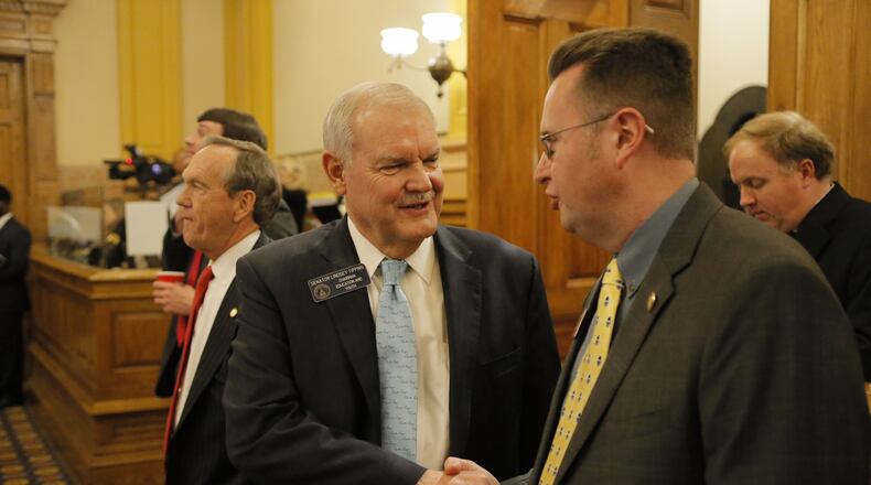ATLANTA, March 24, 2017: Sen. Lindsey Tippins, R-Marietta, (left) shook hands with Rep. Kevin Tanner, R-Dawsonville, after Senate passage Friday of Tanner’s school turnaround legislation, House Bill 338. The House approved the Senate’s changes Monday. It’s the General Assembly’s answer to voter rejection of the Opportunity School District constitutional amendment in November.