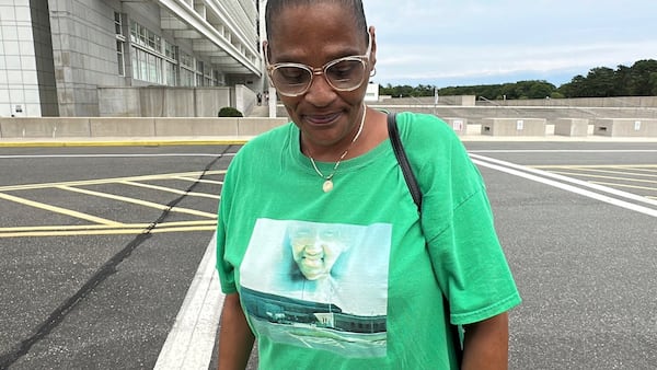 Elizabeth Alvarado stands outside federal court in Central Islip, N.Y., on Wednesday, July 2, 2025, wearing a shirt bearing an image of her daughter, Nisa Mickens, who was slain by MS-13 gang members in 2016. (AP Photo/Philip Marcelo)