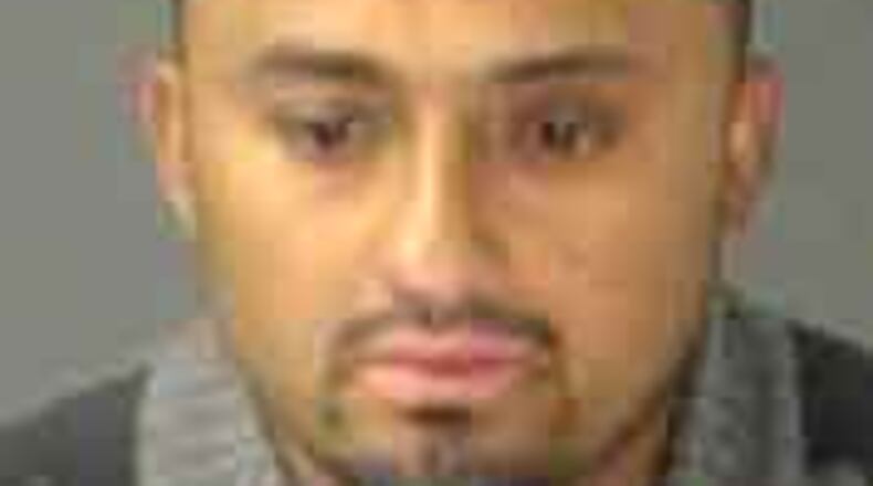 Juan Aviilez Dominguez, 29, is accused of killing a man inside a Sandy Springs apartment Monday night. (Photo: Sandy Springs police)