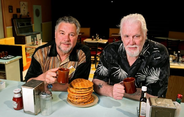 “Waffle Palace Christmas” playwrights Larry Larson (left) and Eddie Levi Lee are shown on the set of “The Waffle Palace” at Horizon Theatre in 2012. AJC FILE PHOTO