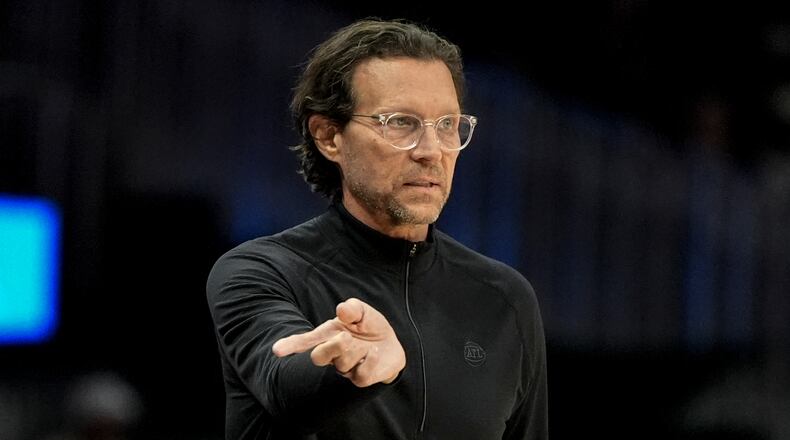 Atlanta Hawks head coach Quin Snyder speaks in the first half of an NBA basketball game against the Boston Celtics, Monday, March 30, 2026, in Atlanta. (AP Photo/Mike Stewart)