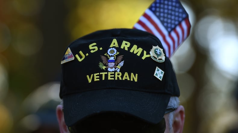 WASHINGTON, DC - NOVEMBER 11:  Gulf War veteran Bill Virill, retires U.S. Army, attends a Veterans Day ceremony at the Vietnam Veterans Memorial November 11, 2014 in Washington, DC. Originally established as Armistice Day in 1919, the holiday was renamed Veterans Day in 1954 by President Dwight Eisenhower, and honors those who have served in the U.S. military.  (Photo by Win McNamee/Getty Images)