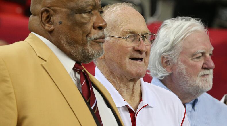 Former Falcon Tommy Nobis (center) is in the company of other franchise greats Claude Humphrey (left) and Jeff Van Note during a 2015 ceremony. ( Curtis Compton / ccompton@ajc.com)