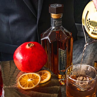 Vegas Placas, lead mixologist for the Loft at Soby’s New South Cuisine, pours a Forbidden Fruit Fashion. Placas created the signature cocktail for the Michelin Guide American South ceremony on Monday, Nov. 3, 2025, in Greenville, South Carolina. (Courtesy of Ariel Madison/Table 301)