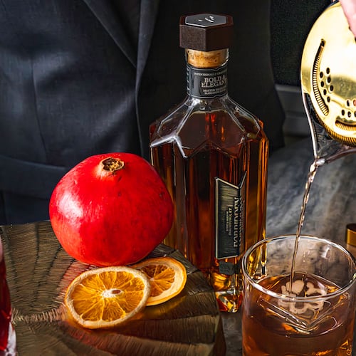 Vegas Placas, lead mixologist for the Loft at Soby’s New South Cuisine, pours a Forbidden Fruit Fashion. Placas created the signature cocktail for the Michelin Guide American South ceremony on Monday, Nov. 3, 2025, in Greenville, South Carolina. (Courtesy of Ariel Madison/Table 301)