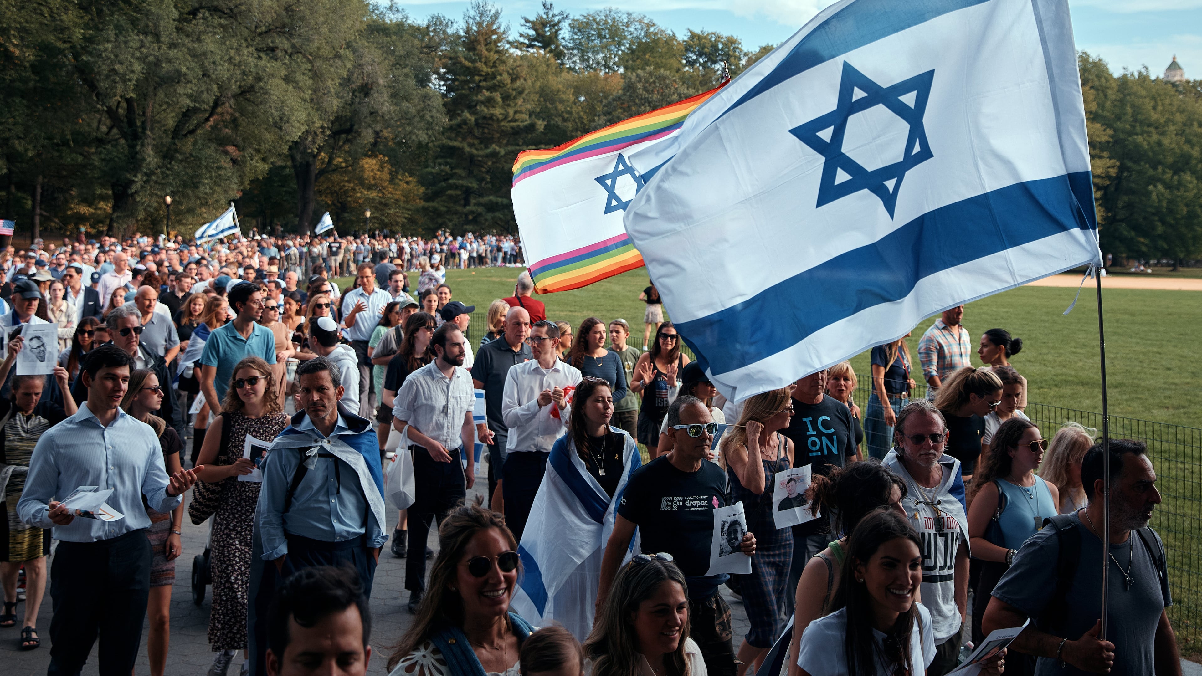 Jews march around the Great Lawn in Manhattan's Central Park for a "Circle of Unity" event marking the second anniversary of the deadly Oct. 7 attack in Israel, on Tuesday, Oct. 7, 2025, in New York. (AP Photo/Andres Kudacki)